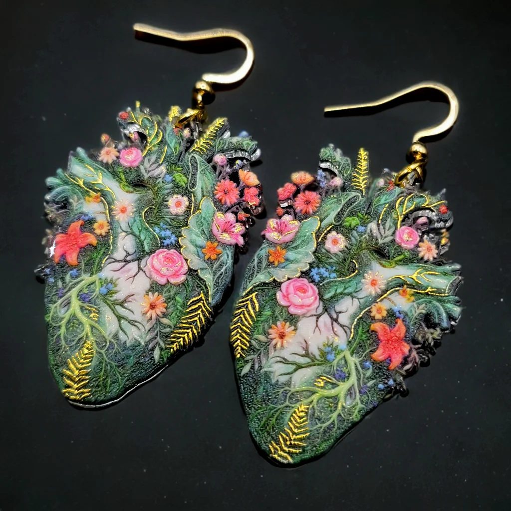 Earrings photographed on a clean dark background, fully in focus.