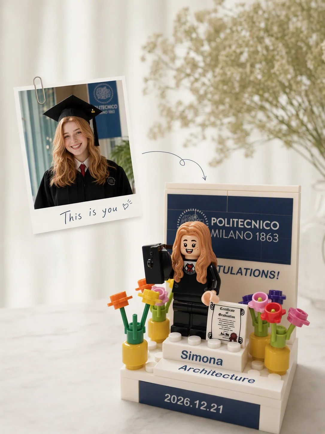 Personalized graduation keepsake built from a photo, with minifigure, flowers and name plate.